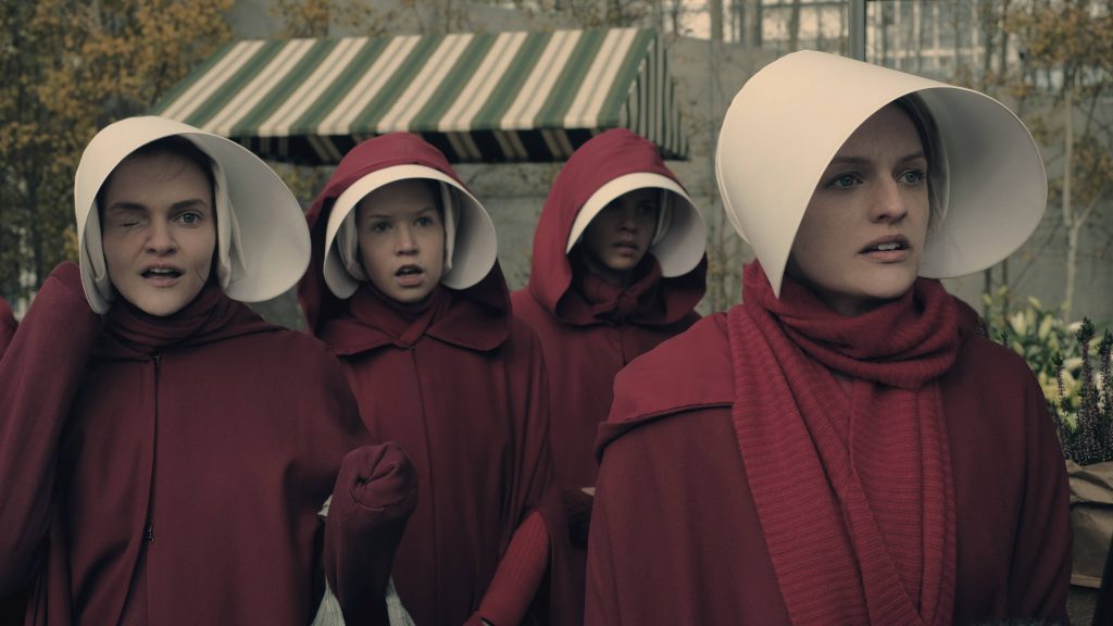 The Handmaid's Tale  -- "Faithful" -- Episode 105 --  Serena Joy makes Offred a surprising proposition. Offred remembers the unconventional beginnings of her relationship with her husband. Janine (Madeline Brewer), left and Offred (Elisabeth Moss), right, shown. (Photo by: George Kraychyk/Hulu)